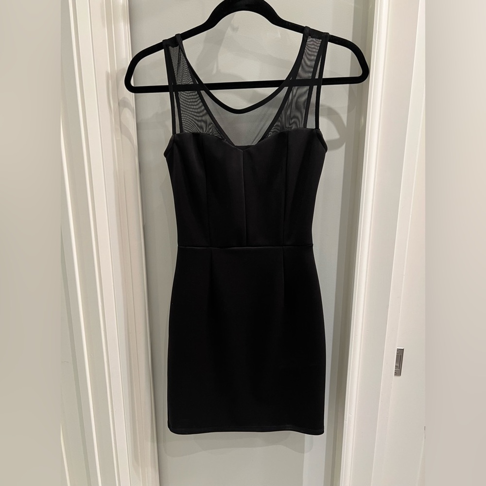 Little black dress with mesh top and bow back